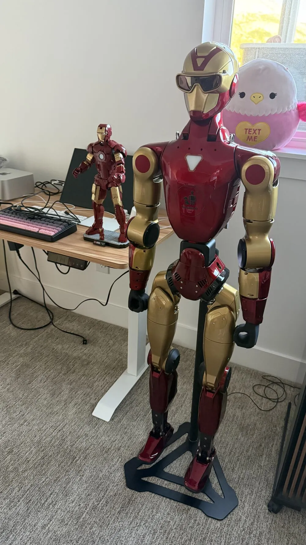 The R1 on its stand next to the Iron Man figure on my desk